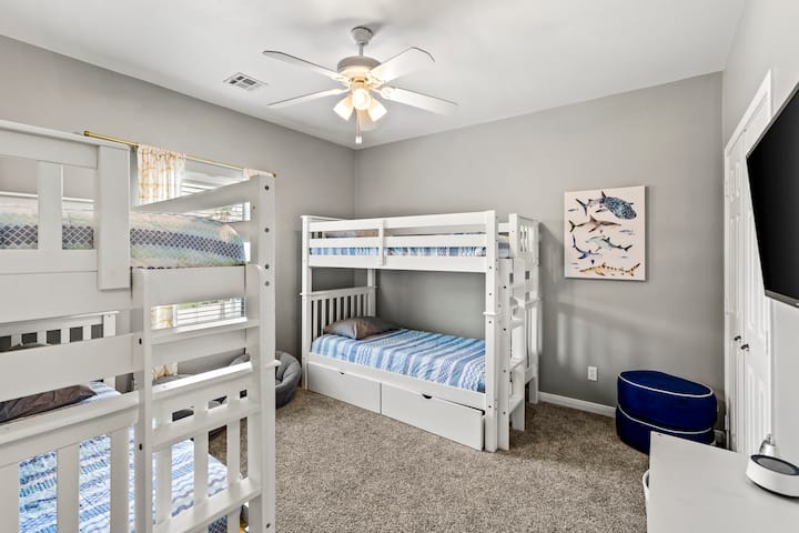 Fun-filled haven with bunk beds, playful decor, and plenty of space for young adventurers!