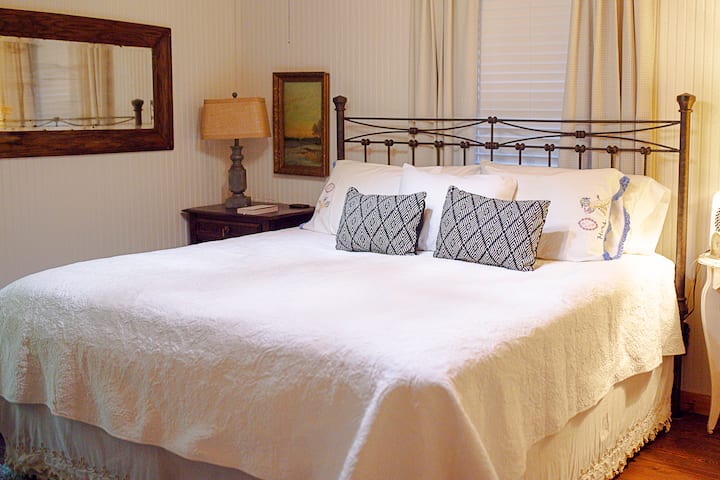 On the main level, you'll find a second king-sized bedroom with a 42" TV and cozy decor details. 