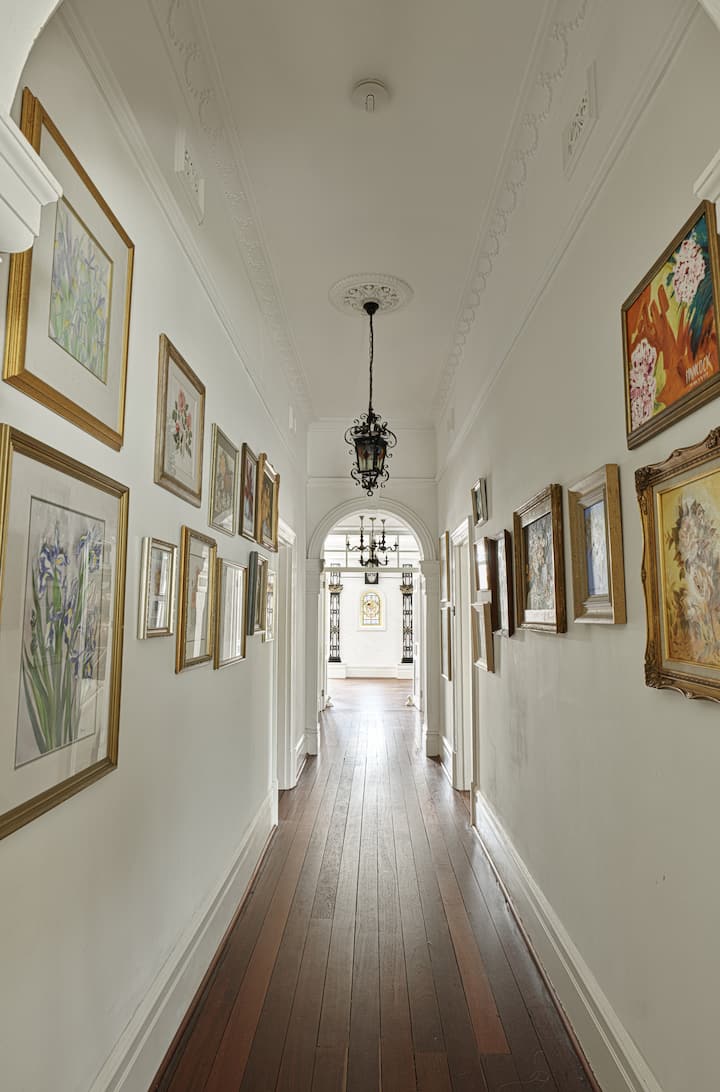 Stunning hallway with original art.