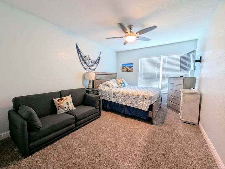 Queen Bed |  Fold Out Couch Sleeps 2 Additional | Smart TV | Gaming Console | Clothing Storage 