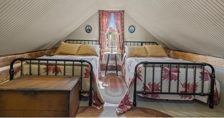 Second bedroom is located upstairs in the spacious loft area.  Two full beds, a seating area, a desk and Roku tv are in this bedroom.  Space includes wifi.