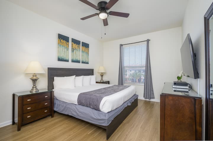 Master bedroom with king size bed, closet, drawers, safe and 50" Smart TV