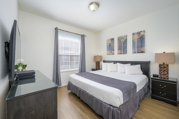 Master bedroom with king size bed, closet, drawers, safe and 50" Smart TV