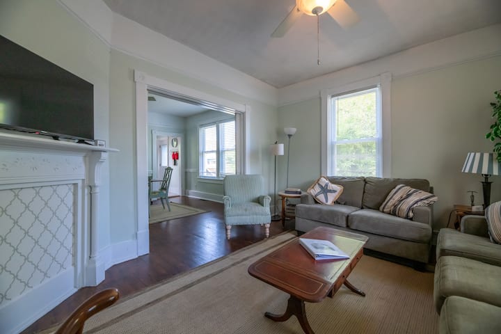 Spacious seating in living room open to dining room. 
