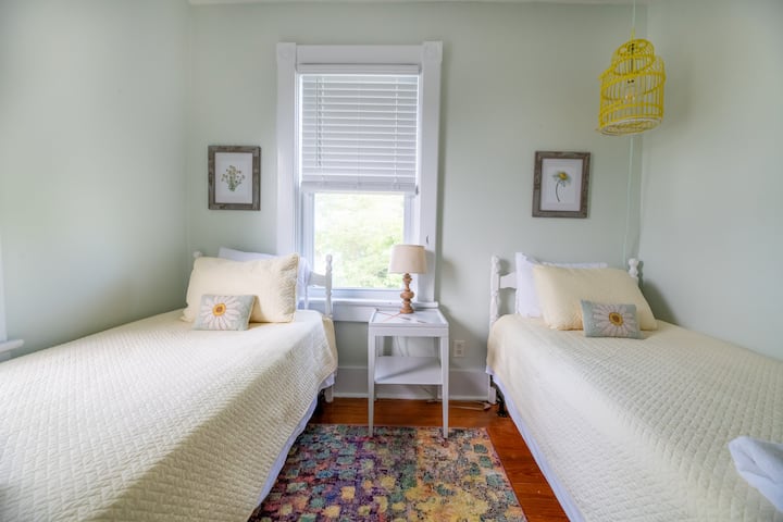 Cozy twin beds provide flexible options for friends or children to share a room.