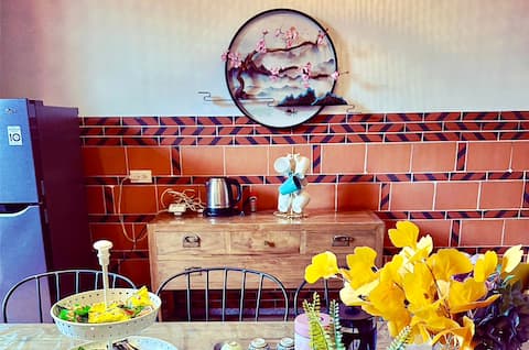 I-Shan House: A sunny start against the mountain backdrop. Entire building for small groups in Kinme