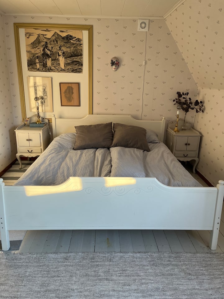 Bedroom 2 upstairs with double bed, desk and wardrobe.