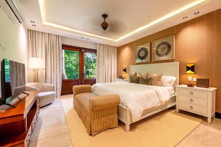 Third bedroom with 1 king bed, en suite full bathroom, split unit AC, and patio with outside seating