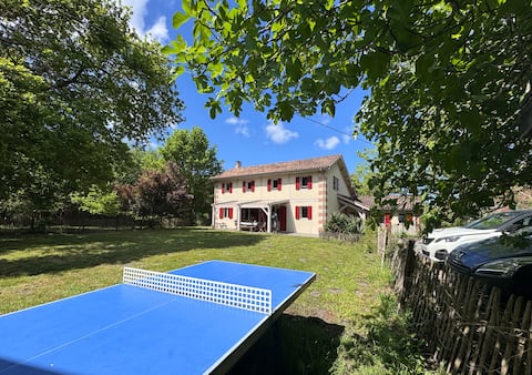 Large house between lake and forest