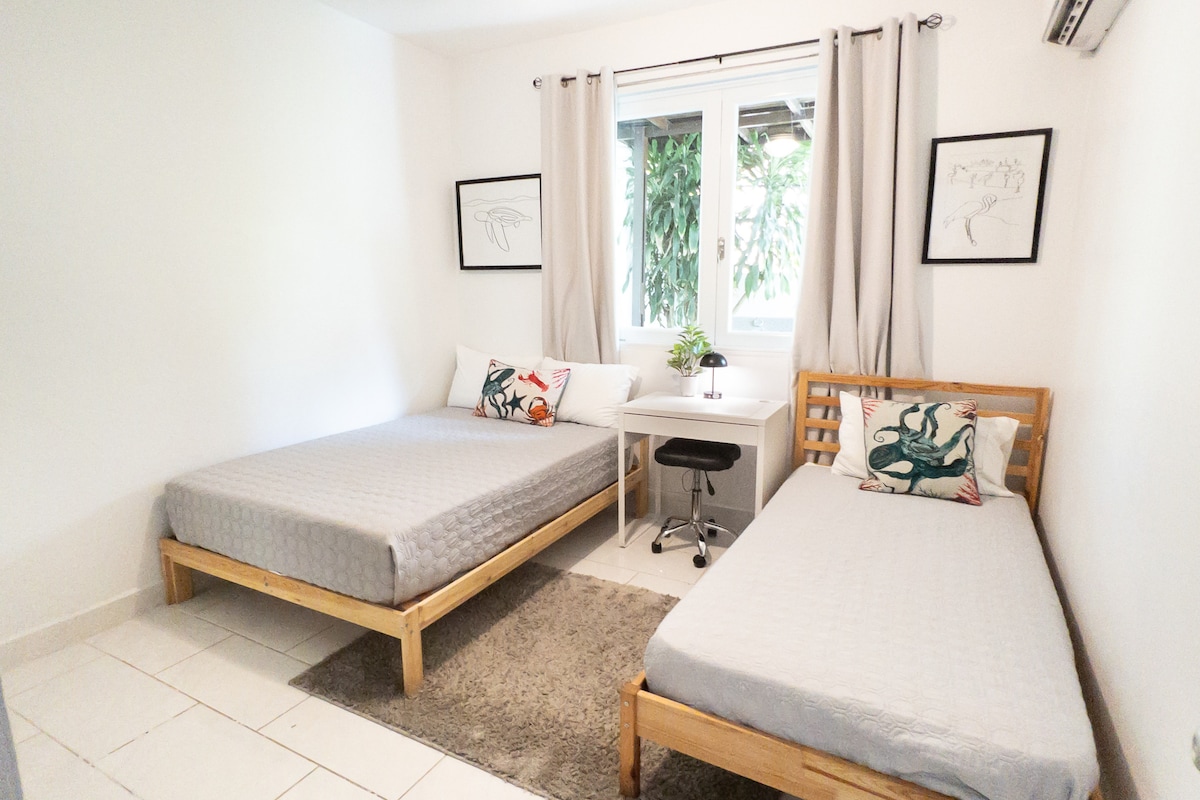 Bedroom 3: Full bed and twin bed, ceiling fan, blackout curtains, inverter AC unit, a dedicated workspace, and a closet