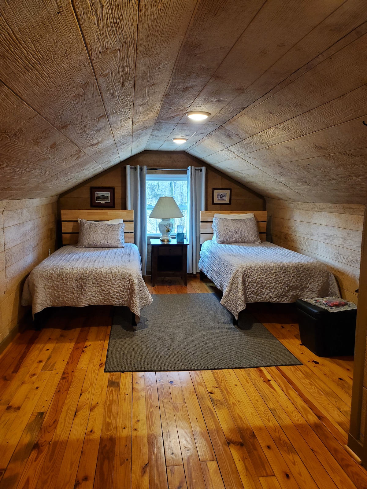 Comfy twin beds in cozy attic space is great for kids or the young at heart. 
Attic has separate heating/cooling and a sitting area with quiet office space. 