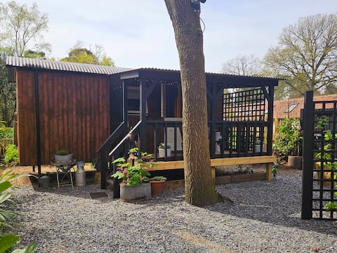 Popular Airbnb listing: Shepherds Hut, Farnham. Situated on Frensham Ponds in Surrey