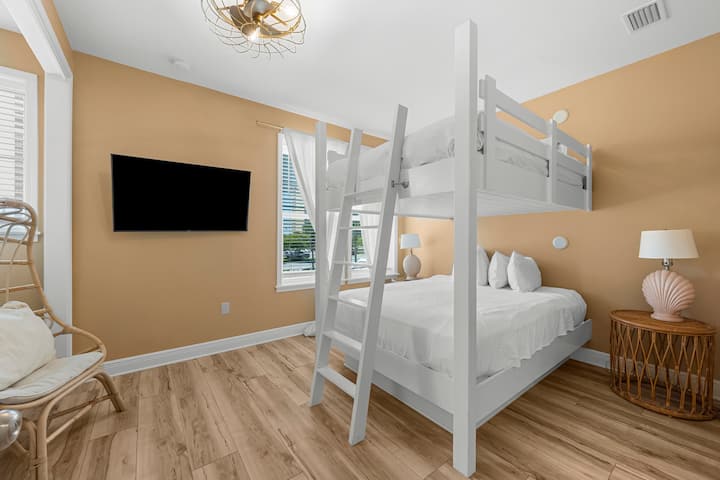Another cozy queen bunk bedroom upstairs — perfect for late-night laughs and lounging!
