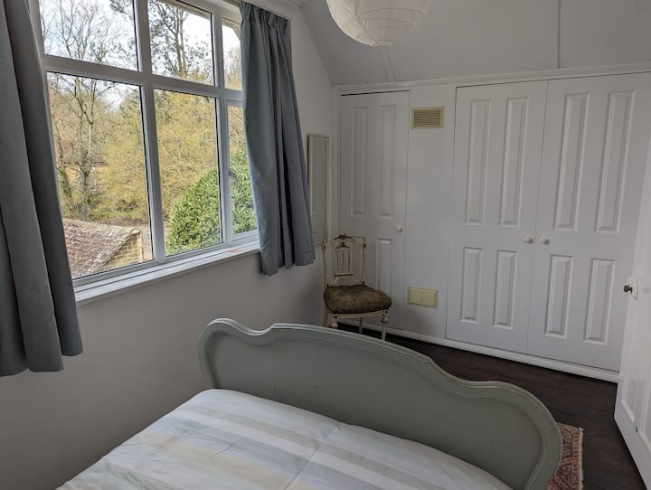French antique bed and plenty of cupboard and hanging space.