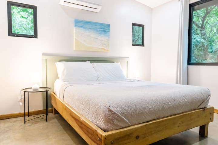 The bedroom has a queen bed, A/C and a roof fan in case you prefer natural ventilation. 