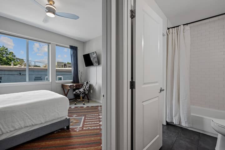 The guest bedroom has its own TV and working station to satisfy all of your work from home needs. 