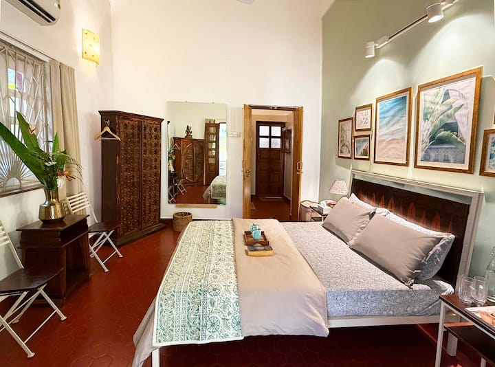 Featuring a harmonious blend of antique and modern organic furniture, the guest bedroom offers a stylish yet comfortable retreat. The entrance to the main bathroom and guest bathroom is just across the hall.