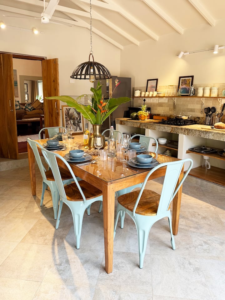 Villa Artjunas kitchen connects seamlessly between your living room, to the pool and cabana space. It is an ideal setup for a breezy lunch with friends. At the back of the image you can see the entrance to the living room.