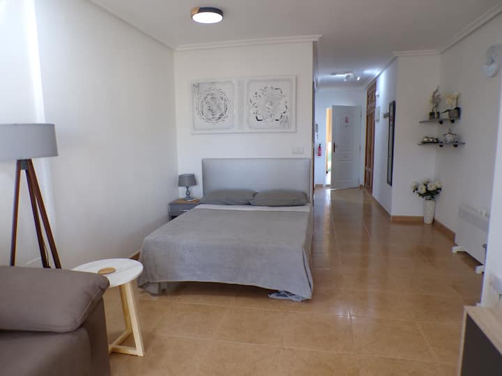A very comfortable Double bed with overhead remote dimmer light and a bedside light to read with if required.