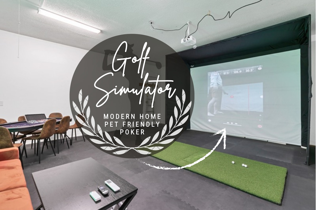 A spacious entertainment area is equipped with a golf simulator displaying a golf swing. A putting green and poker table are visible, surrounded by several chairs, creating an inviting space for games and relaxation.