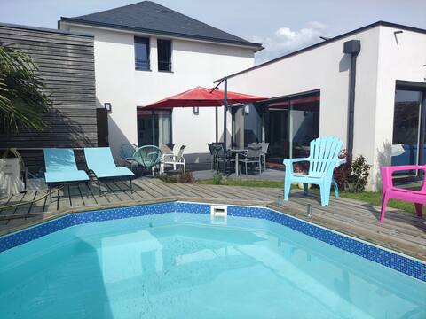 House with heated pool by the sea