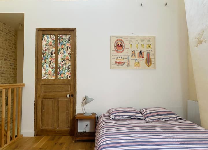 The upstairs landing with a double bed