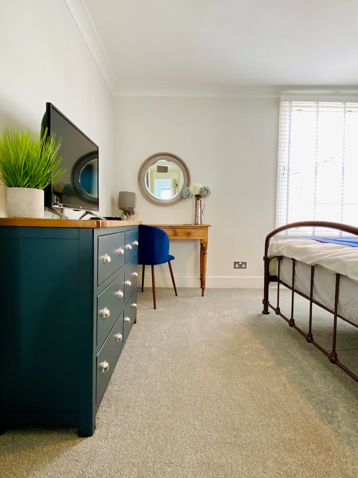 The master bedroom has lots of storage with a full size wardrobe as well as the chest of drawers and bedside tables.