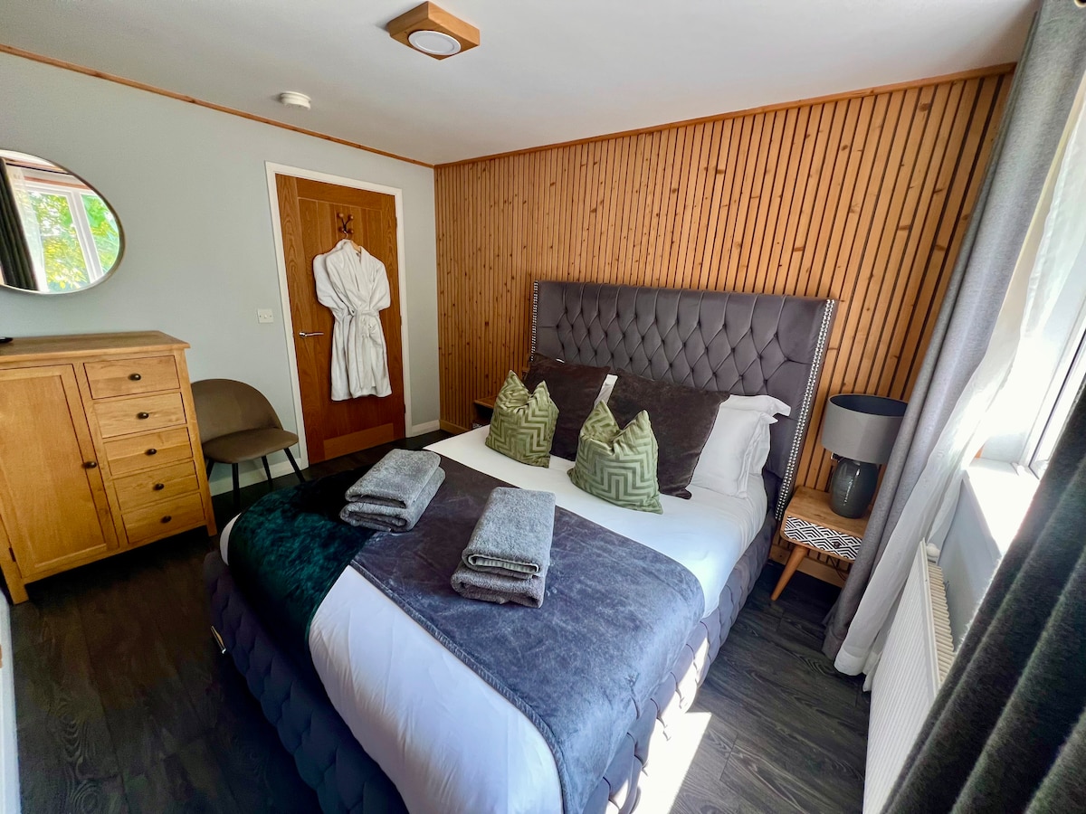 Kingsize bed with Egyptian cotton bedding, smart TV, dressing gowns and towels provided for each guest.