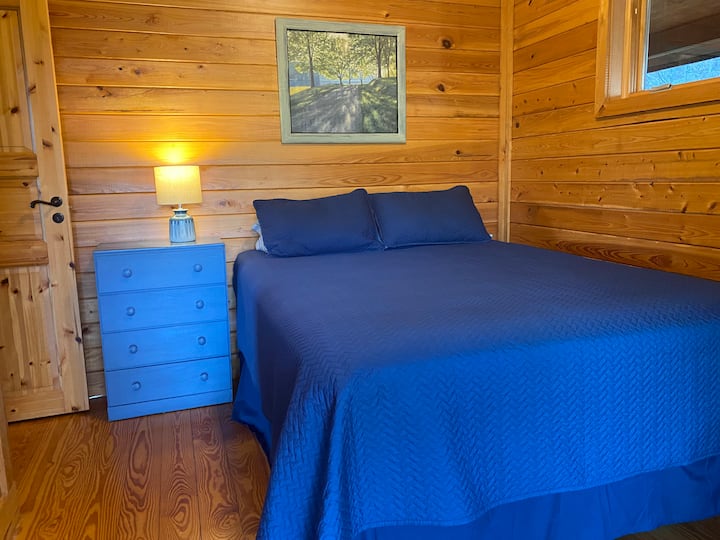 Main level bedroom: queen size bed, closet, slider to the wraparound deck. Just steps from the bathroom.
