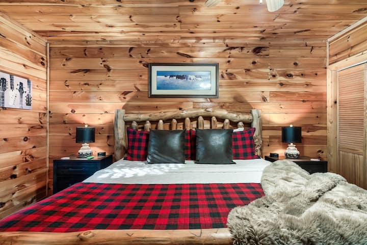 On the lower level, the master bedroom includes a comfortable king bed and a Roku TV for your entertainment, and an iron and ironing board in the closet