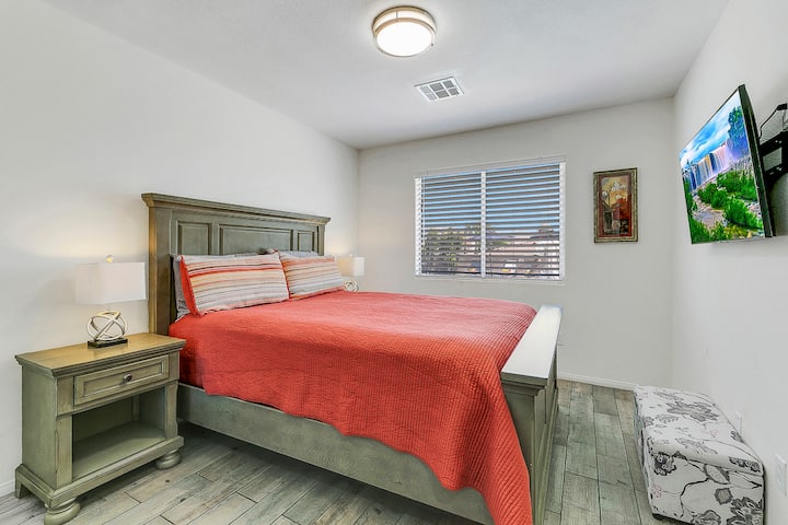 Bedroom 2 which includes a queen sized bed and walk in closet