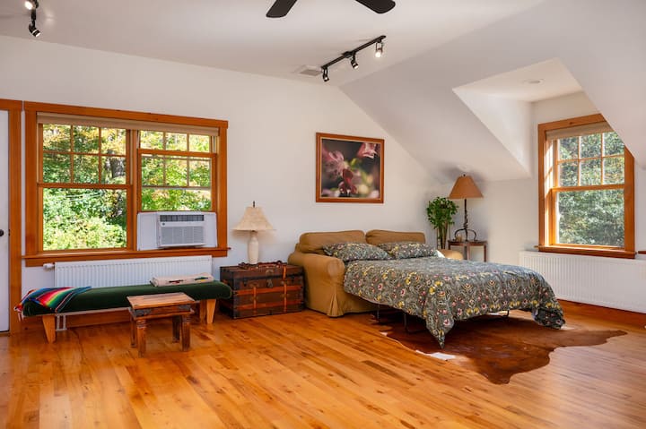 Queen sofa bed, view of tennis court and balcony out back door above hot tub.  Large workout area with treadmill (not pictured).  Office area with 2 desks and large monitors.