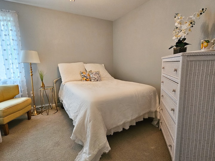 Set against robin's egg blue, the daffodil colored accents smile like the sun in The Yellow Room. You will find this sweet and comfortable bedroom upstairs next to the guest bath.  (Bedroom #3)