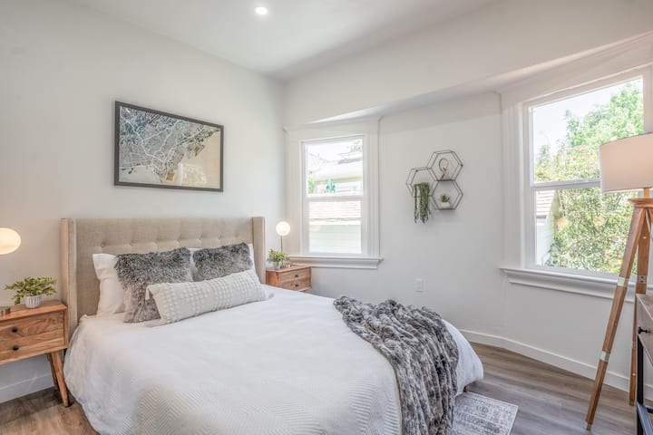 Spacious bedroom with a comfortable queen bed for a restful night's sleep.