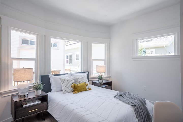 Charming bedroom with a cozy queen bed, perfect for a relaxing stay.