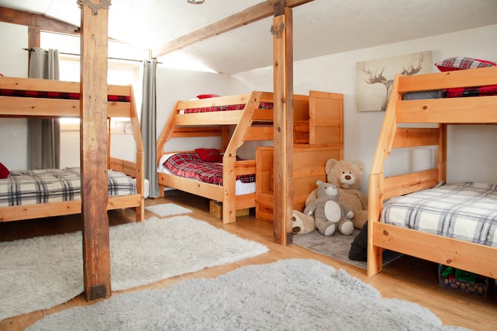 Bunk room with  bunk beds, each including a full on the bottom and a twin on top.