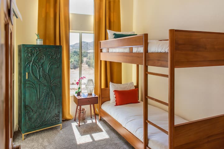 Bedroom #2 features twin bunk beds complete with beautiful views, sliding doors, closet and wardrobe.