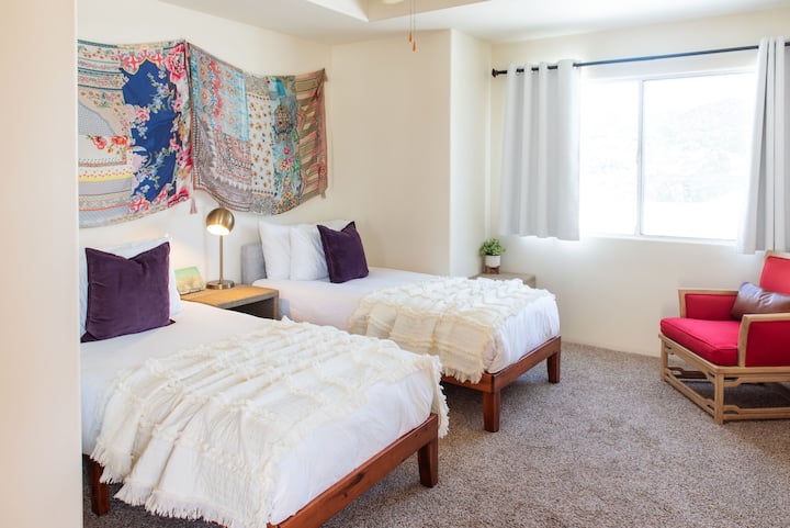 Bedroom #5 can be configured as 2 twins (or 1 king) and has beautiful views, closet, and ceiling fan