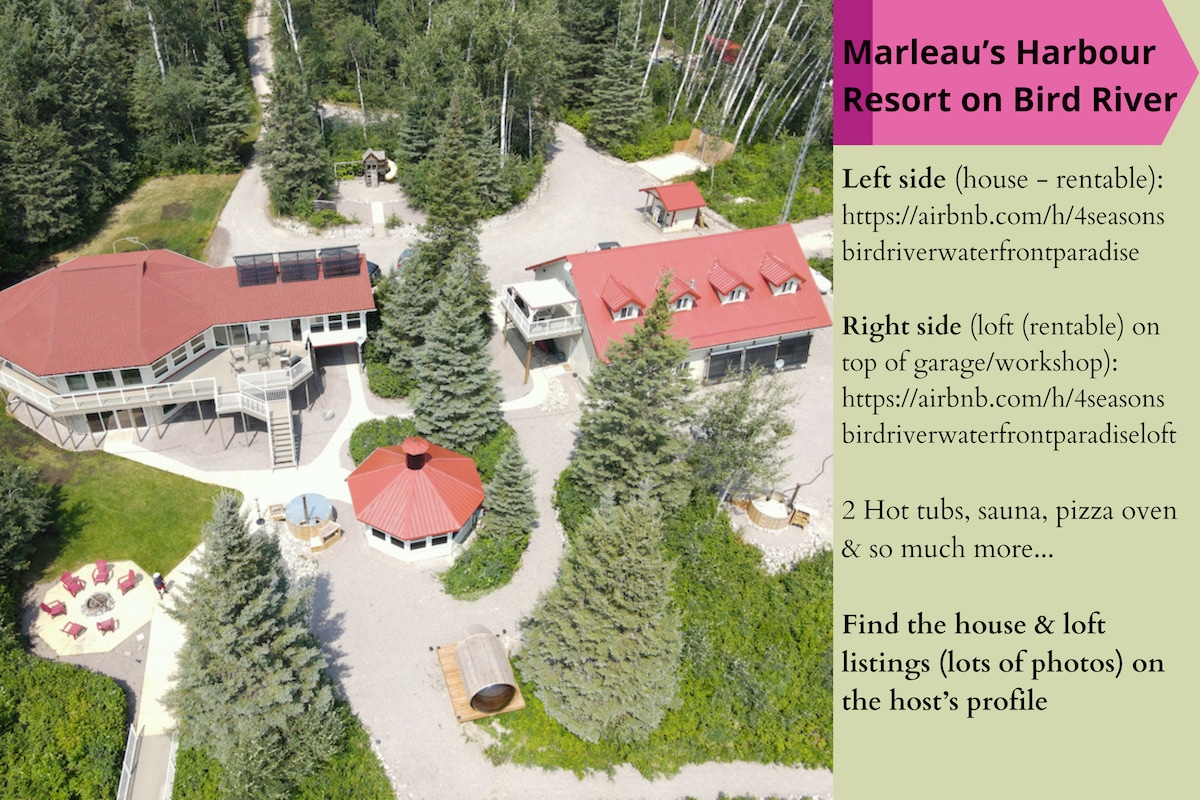 The image displays a bird's-eye view of Marleau’s Harbour Resort, featuring two distinct buildings surrounded by trees. The house is on the left with a red roof, and the loft is on the right, situated above a garage. Two hot tubs and a pizza oven are visible on the property.
