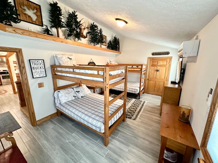 Bunk room-two bunk beds with full beds on the bottom and twins on the top, large closet, bench, tv