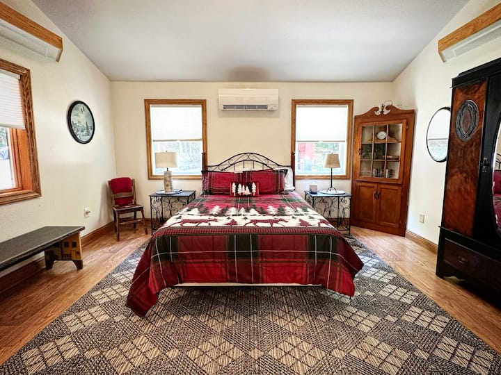 Main level bedroom-queen bed, wardrobe, tv