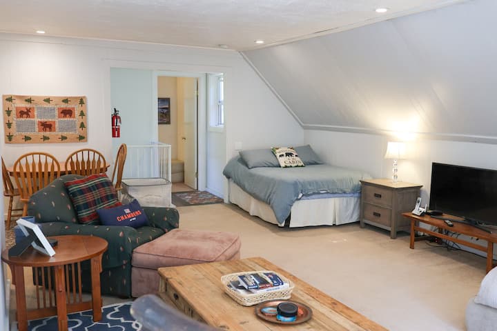Welcome to Bedroom 3- the large loft.  This space features 3 beds, a small tables and chairs along with an oversized chair, rocking chair and coffee table.  It's the perfect room to socialize and hang out.
