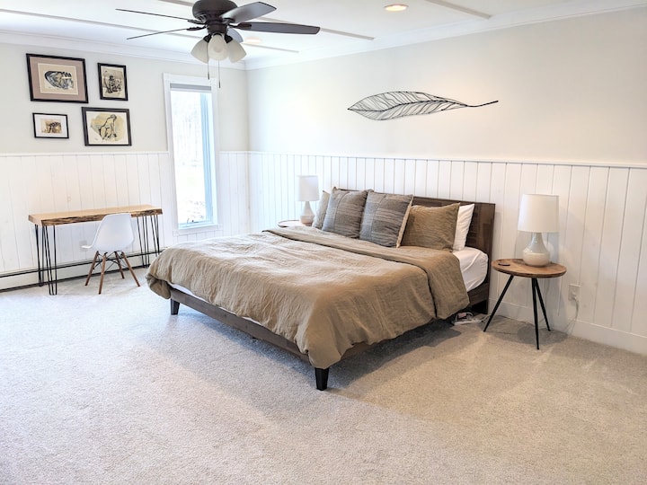 King bedroom, 2nd floor, with desk, ceiling fan, en suite full bathroom and beautiful views.