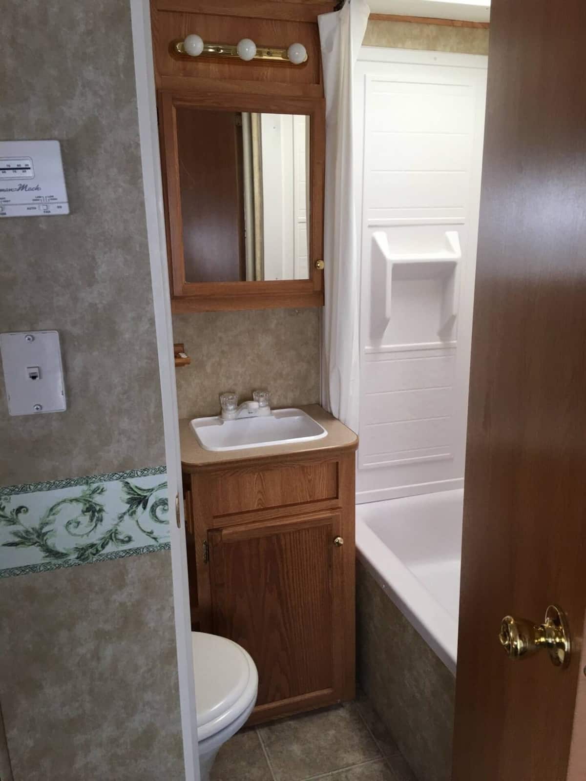 Full bathroom with tub and shower