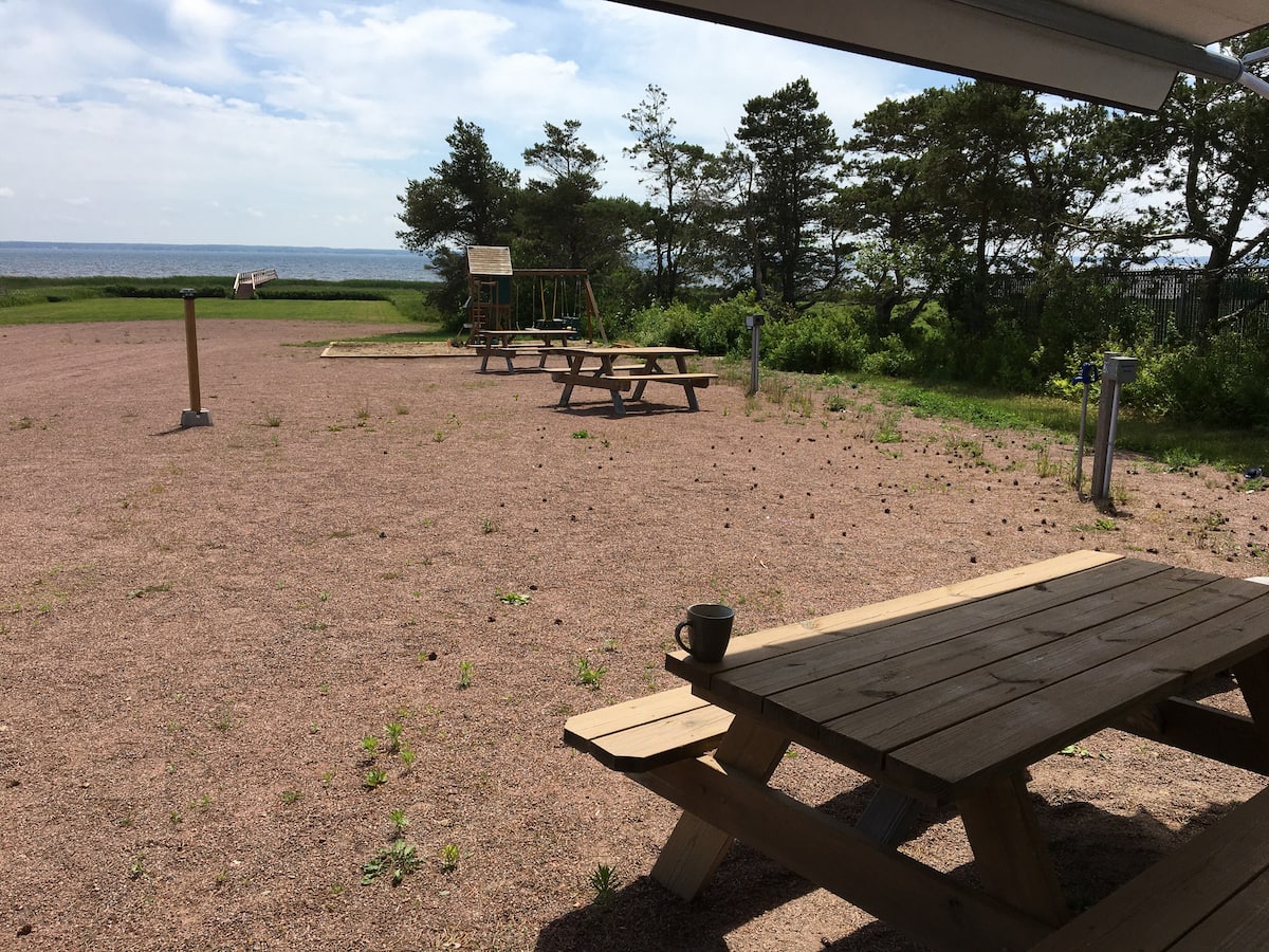 Open grounds with picnic tables and ocean views
