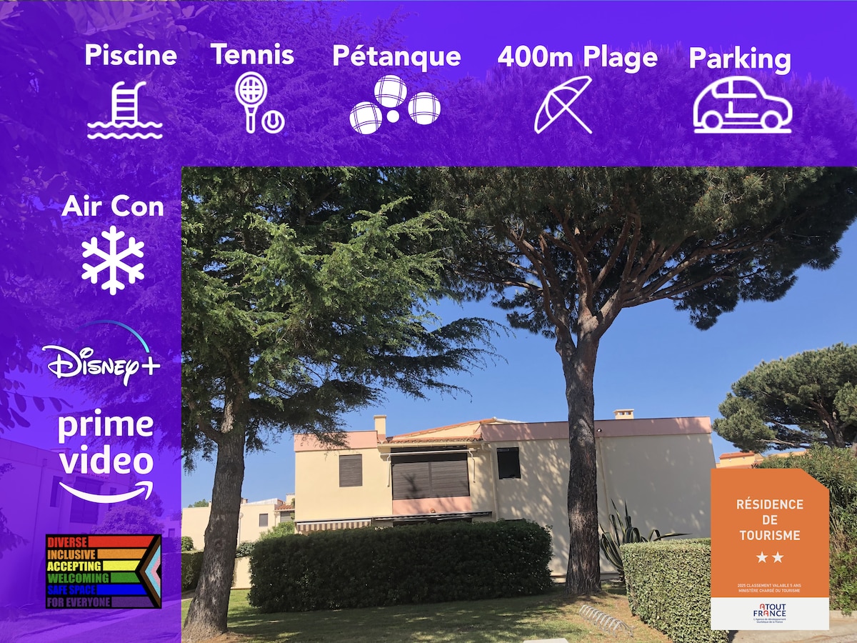 The image displays a well-maintained residential complex featuring a swimming pool, tennis court, and petanque area. A pathway leads to the beach, located 400 meters away. Parking facilities are available. Tall trees provide shade, contributing to a serene outdoor environment.