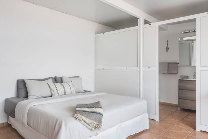 Bedroom Retreat: Modern design with plush bedding and sleek en-suite for ultimate relaxation!