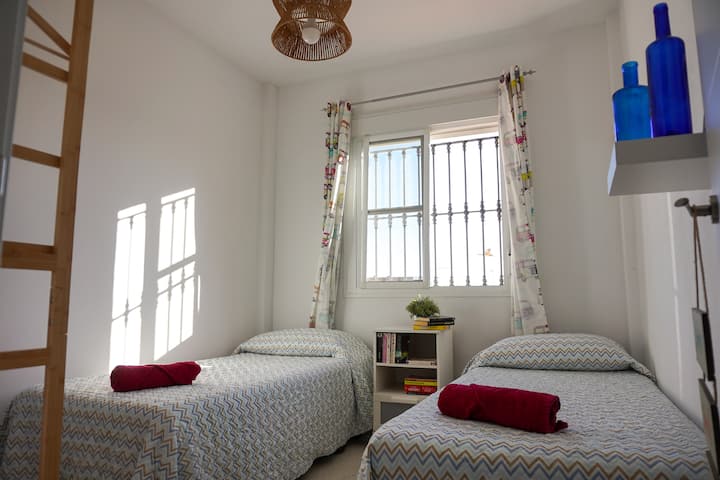 Step into our second room offering two separate beds, spacious accommodations, and breathtaking sea views. Relax and unwind in comfort while enjoying the beauty of the ocean from your window.