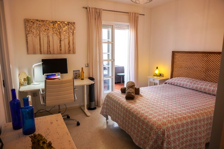 Indulge in our spacious master bedroom featuring a king-size bed, ensuite bathroom, dedicated workspace, and direct access to a large terrace. Perfect for relaxation and enjoying the outdoors right from your room.