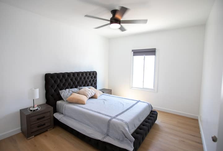 The fourth bedroom has a queen sized bed and two nightstands